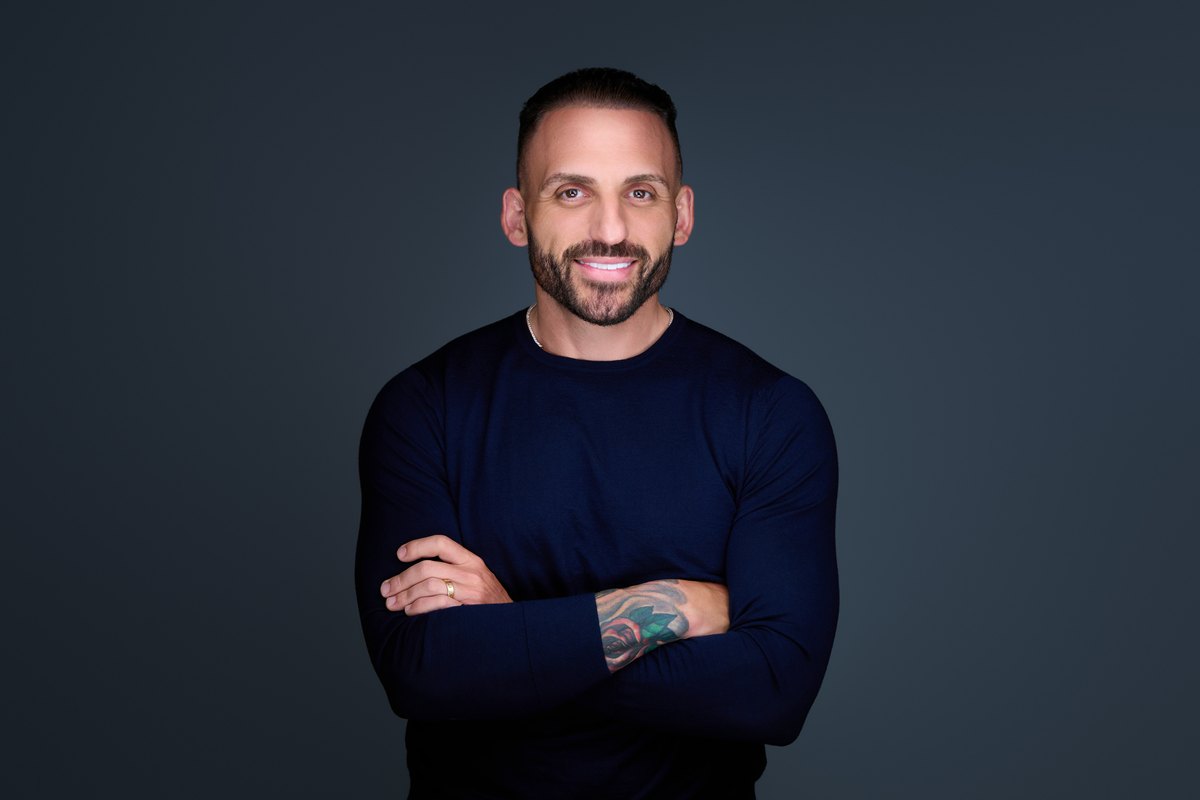 Editorial personal-branding portrait on a dark background
